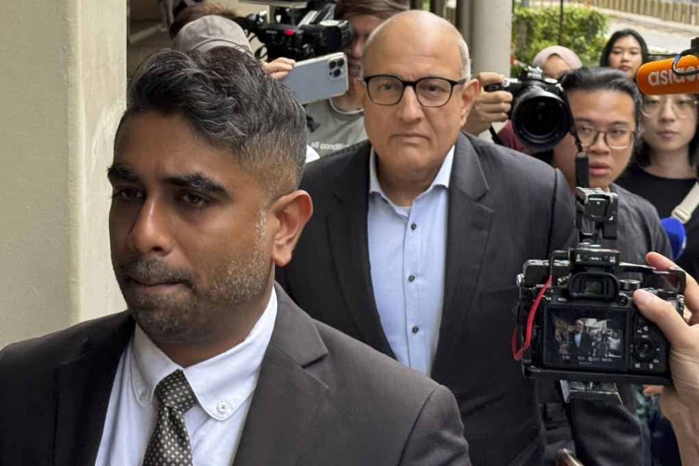 Former transport minister S. Iswaran (centre) and his lawyer at the High Court in Singapore on October 3, 2024. Photo: AP