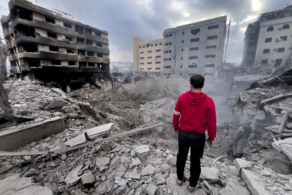A man looks at destroyed buildings hit by Israeli air strikes in Dahiyeh, Beirut, Lebanon. Photo: AP