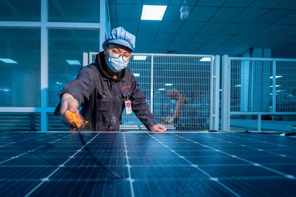 A worker produces photovoltaic modules for export at a factory in Yangzhong, in China’s eastern Jiangsu province, in 2023. The bulk of industrial policies in China and the US today are not beggar-thy-neighbour. In fact, many should be considered enrich-thy-neighbour. Photo: AFP