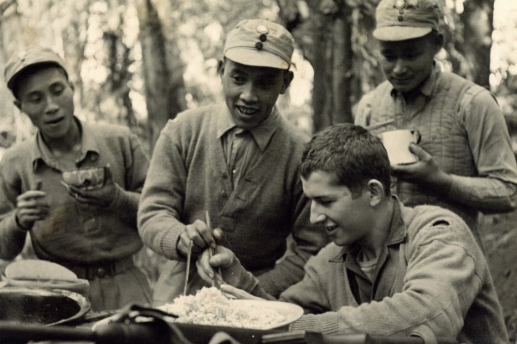 An exhibition of photos taken during WWII of Chinese and US soldiers serving side by side - including this image of US soldier Edward McNamara being taught to use chopsticks - has opened in Beijing. Photo: Zou Dehuai