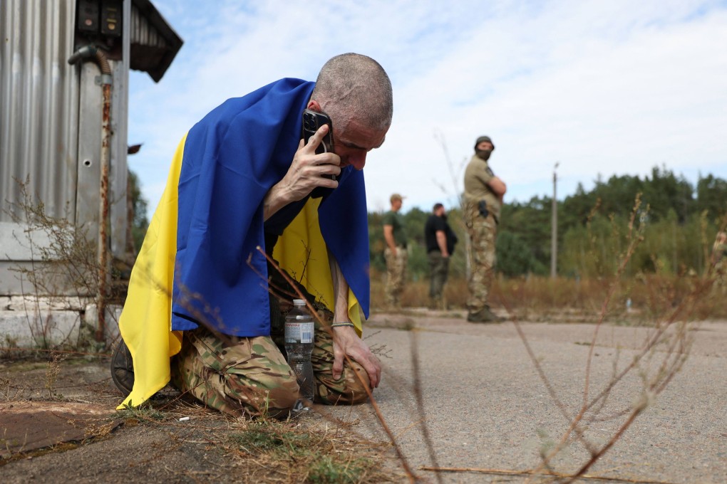 A Ukrainian serviceman calls home after being released from Russian captivity at an undisclosed location near the Ukrainian-Belarusian border on September 13. Ukraine has intensified its mobilization drive this year, reflecting the country’s dire need for fresh recruits. Photo: AFP