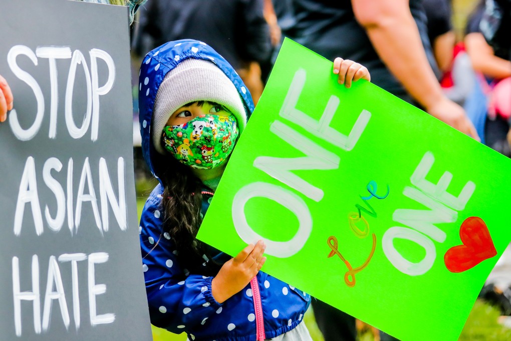 A child holds up a sign at a Stop Asian Hate rally in San Jose, California, in April 2021. Photo: Xinhua