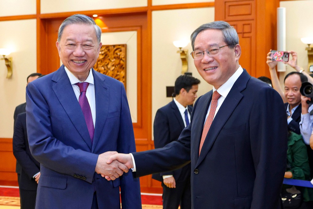 Vietnamese President To Lam greets  Chinese Premier Li Qiang in Hanoi on Saturday. Photo: Xinhua