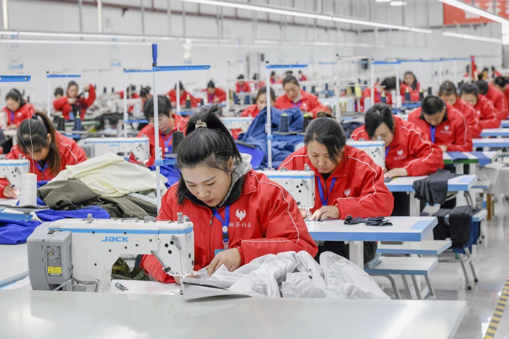 Workers sew at a garment company in Zunhua, Hebei province, on January 3. Photo: Xinhua