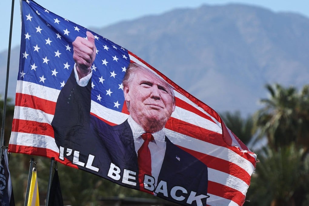 A Trump flag flies before a campaign rally in Coachella, California, on Saturday. Photo: AFP