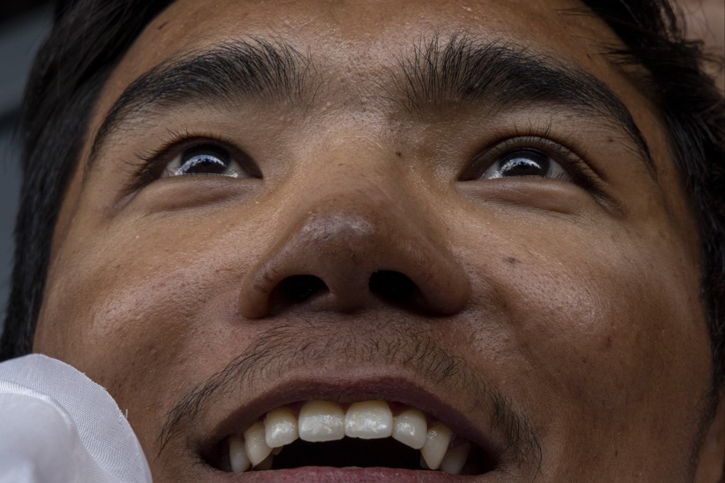 Nepalese mountaineer Nima Rinji Sherpa, 18, reacts as he arrives in Kathmandu on Monday. Photo: EPA-EFE/