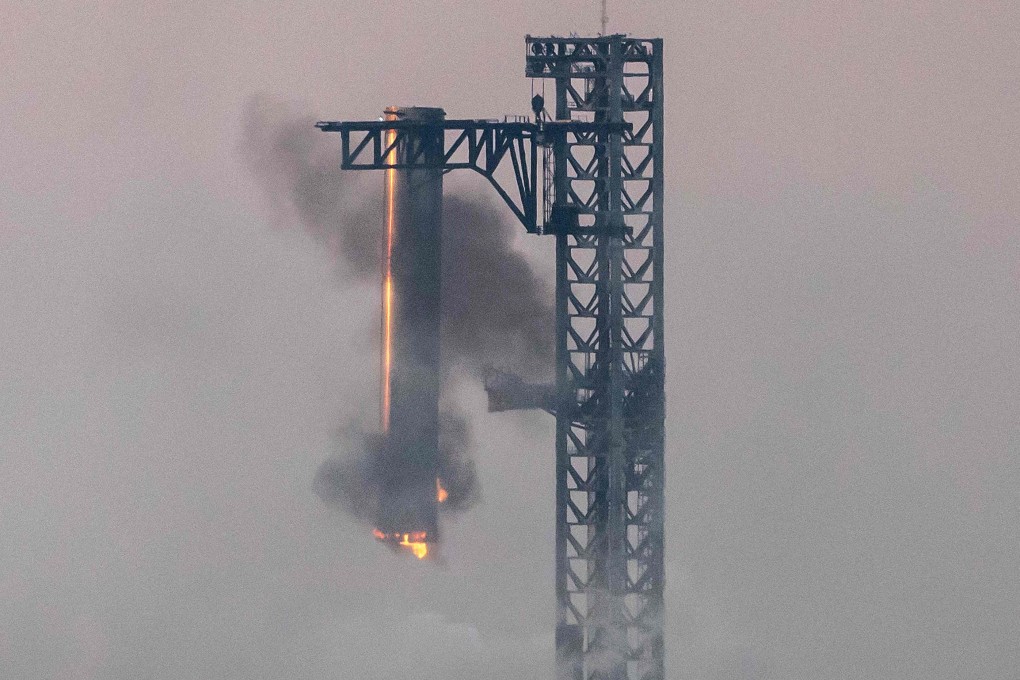 Starship’s Super Heavy Booster being grappled at the launch pad. Photo: AFP