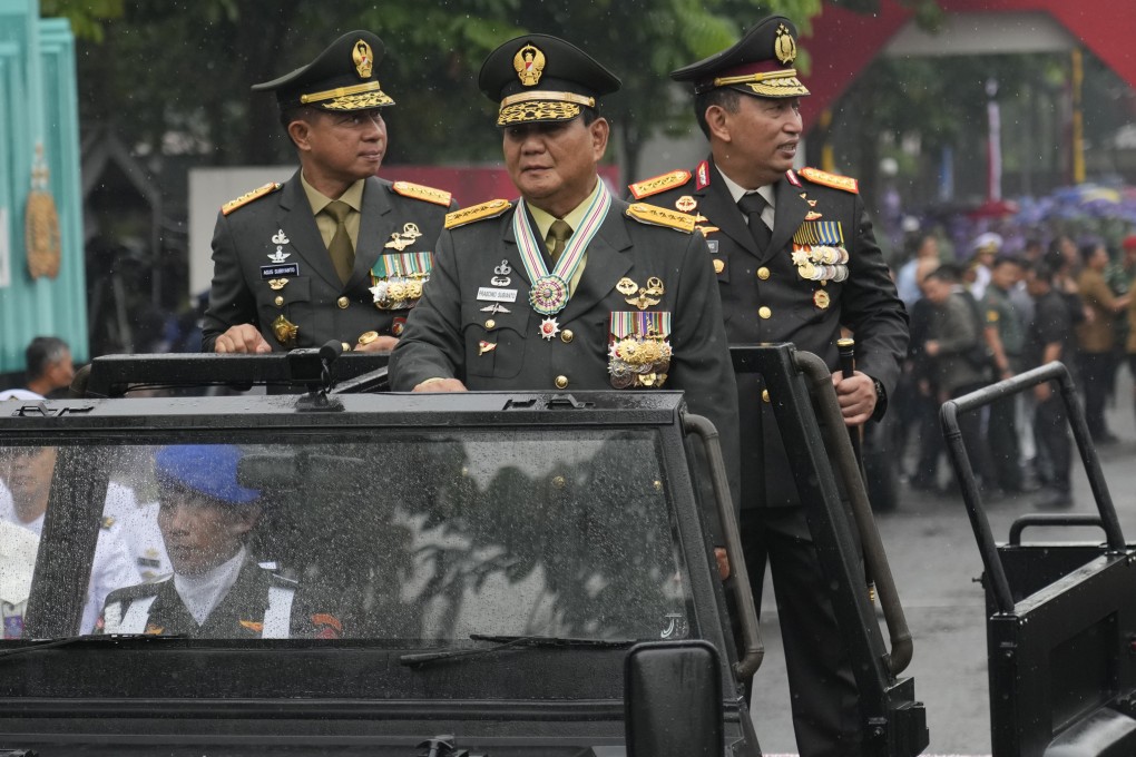 Prabowo takes part in a military inspection in February after being made an honorary four-star general by President Joko Widodo. Photo: AP