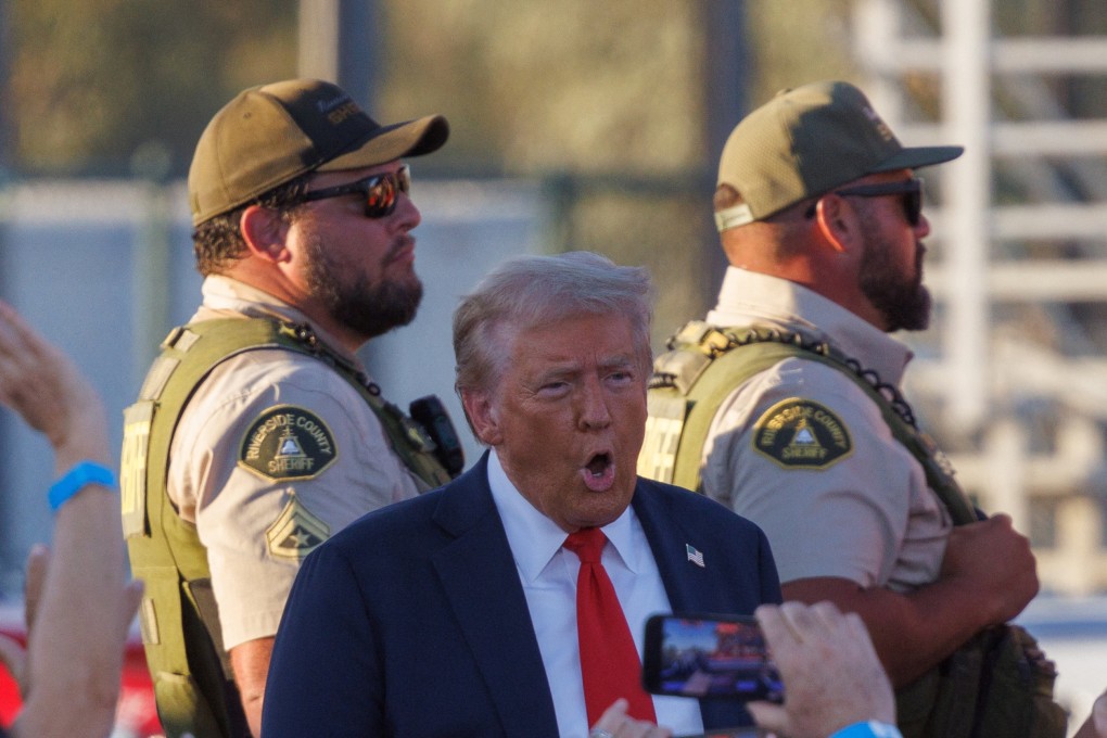 Riverside Country Sheriffs stand guard as Donald Trump arrives at his rally in Coachella, California, on Saturday. Photo: Reuters