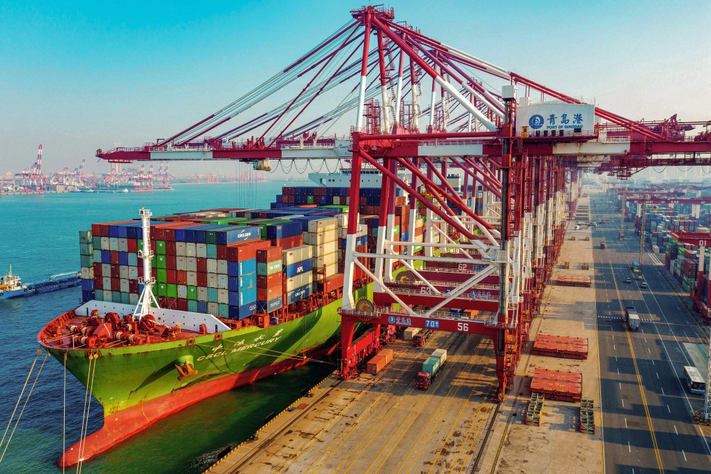 A cargo ship loaded with containers berths at a port in Qingdao, in China’s eastern Shandong province. Photo: TNS