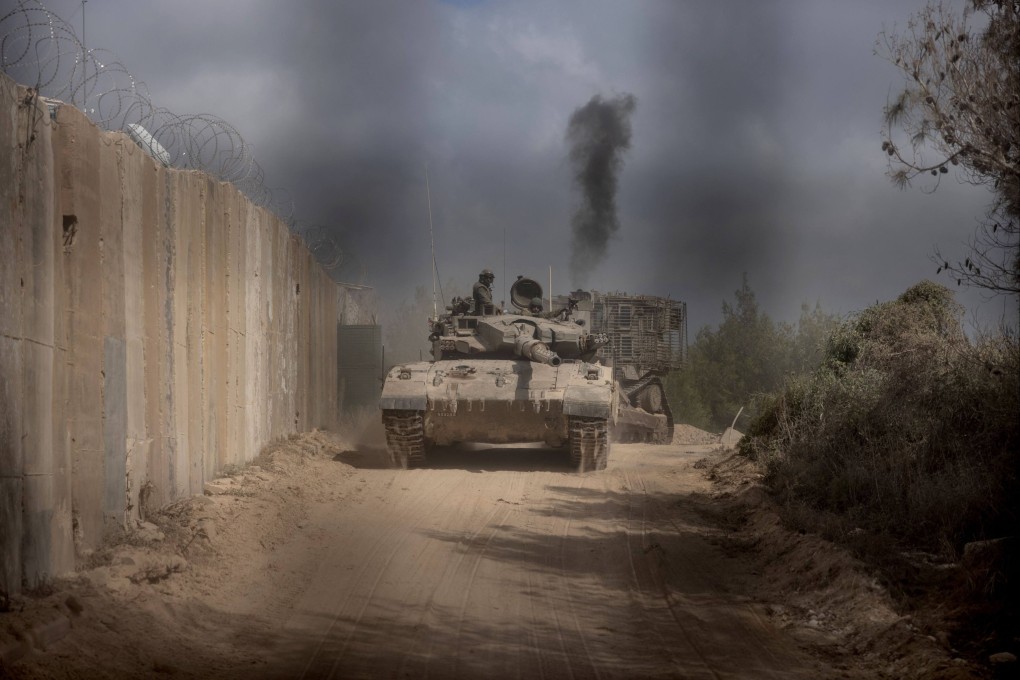 An Israeli battle tank entering Lebanon from northern Israel at the southern Lebanese border point of Naqoura. Photo: AFP