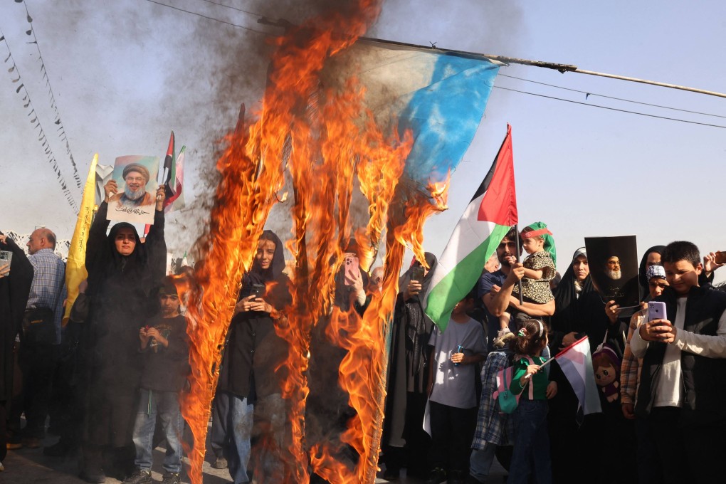 Iranians burn an Israeli flag during a rally in Tehran on October 2, 2024, a day after Iran fired a barrage of missiles at Israel. Photo: AFP