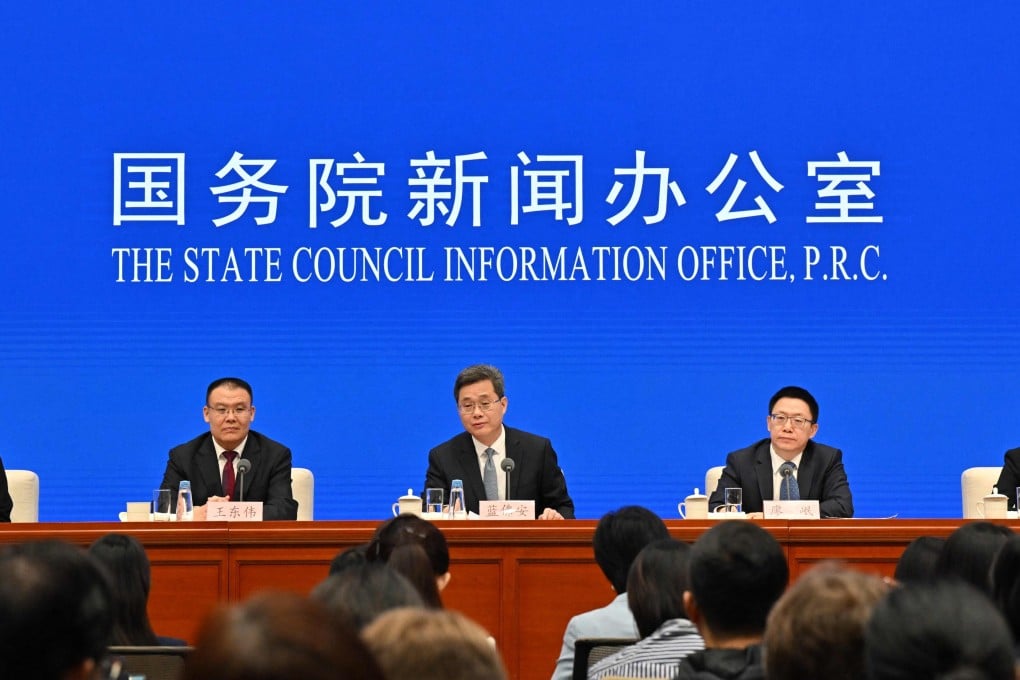 China’s finance minister, Lan Foan (centre), appears at a press conference in Beijing on Saturday. Photo: AFP