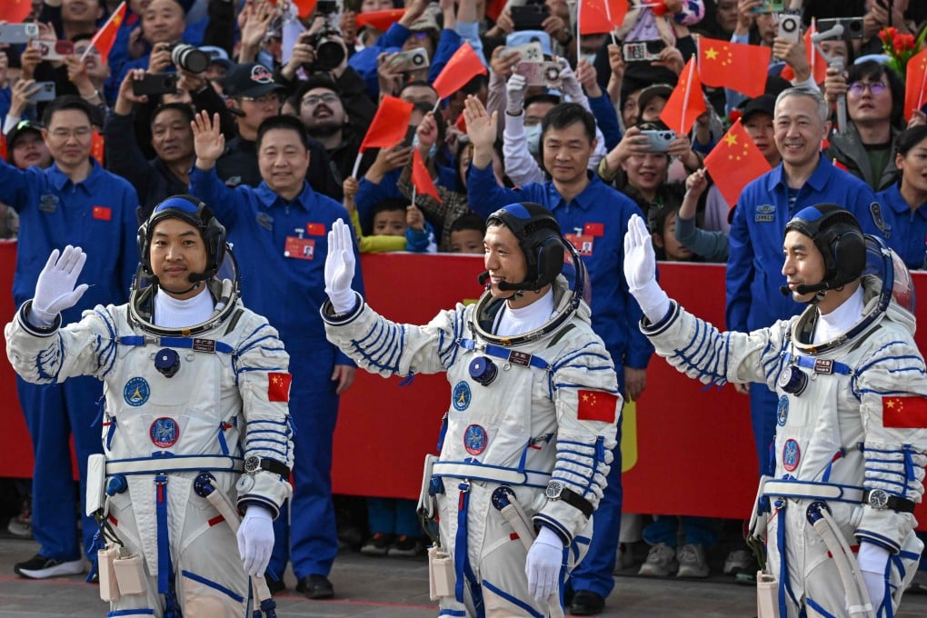 Chinese astronauts (from left) Li Guangsu, Li Cong and Ye Guangfu wave before their journey to the Tiangong space station aboard the Shenzhou-18 in April. Photo: AFP