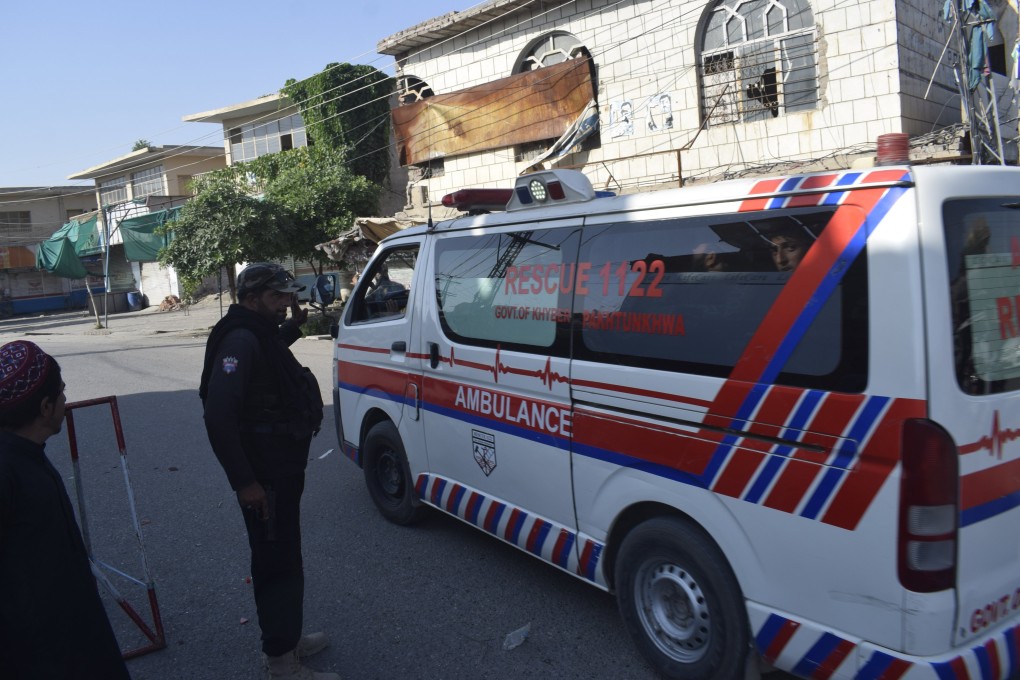 An ambulance drives past a checkpoint leading to the site where Pakistani Taliban militants attacked police officers in Bannu, Pakistan on Monday. Photo: EPA-EFE