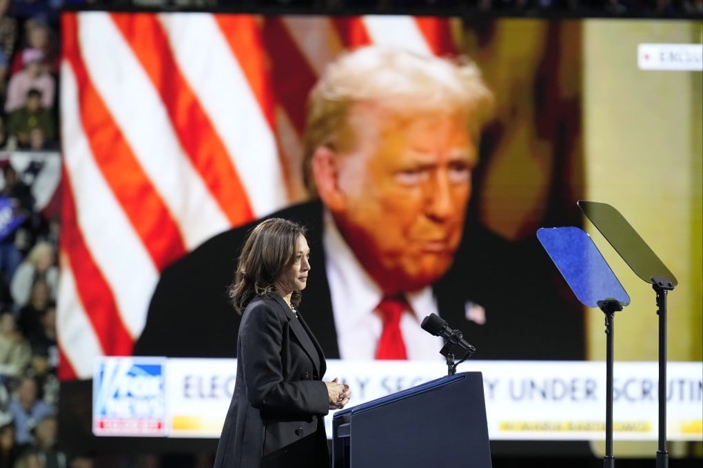 US Vice-President Kamala Harris speaks as an image of Donald Trump appears on screen during a campaign rally in Erie, Pennsylvania. Photo: AP
