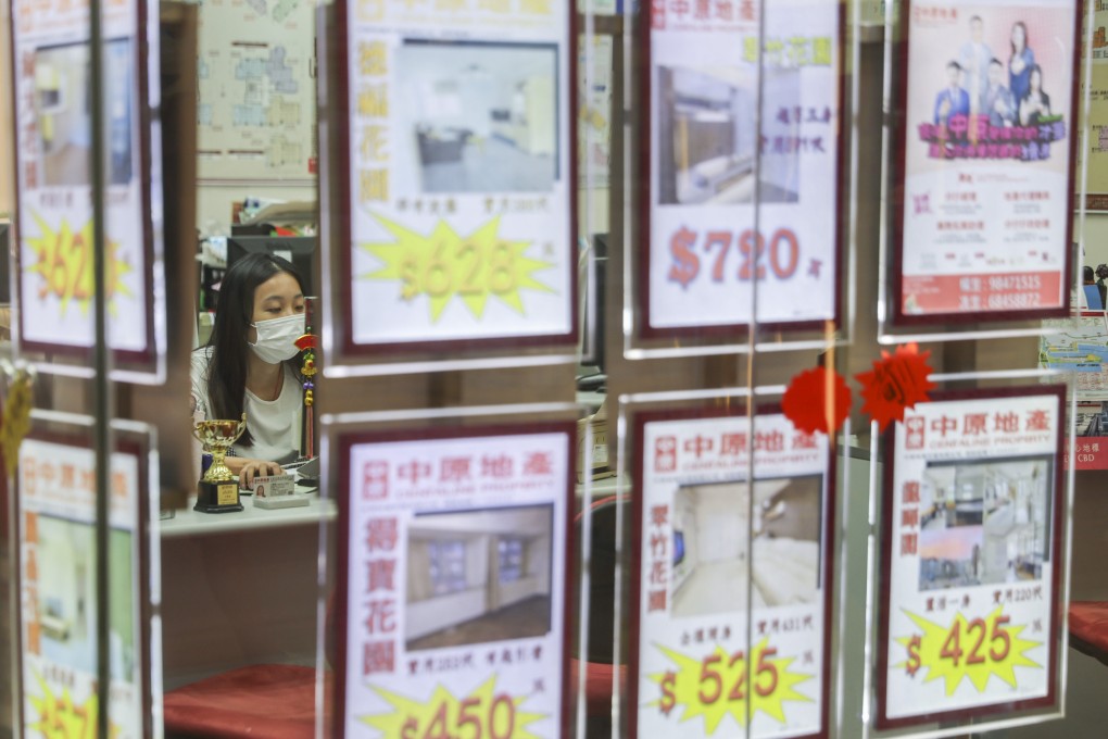 An agent works at a real estate agency in Hong Kong’s Wong Tai Sin district, on July 19, 2022. Photo: Edmond So