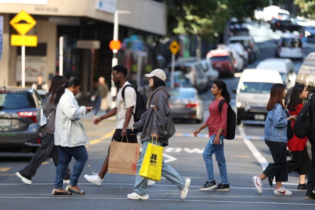 Pedestrians on Queen Street in Auckland. Wednesday’s change means a victim of domestic violence can seek dissolution of their marriage or civil partnership as soon as a protection order against their spouse is granted. Photo: Bloomberg