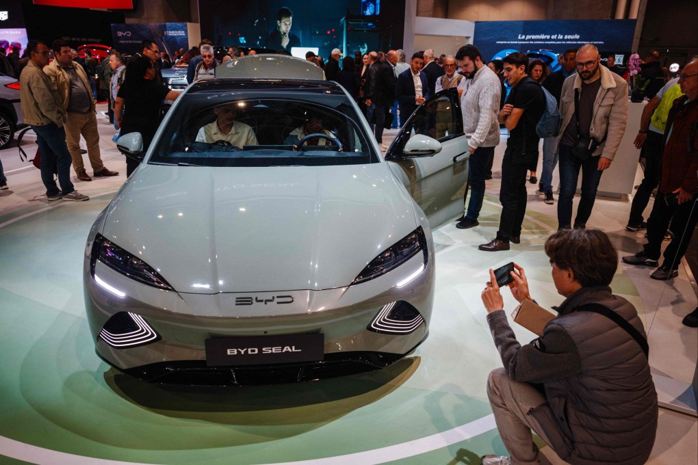 Visitors look at a BYD Seal electric car at the Paris Motor Show,  October 15, 2024. Photo: AFP