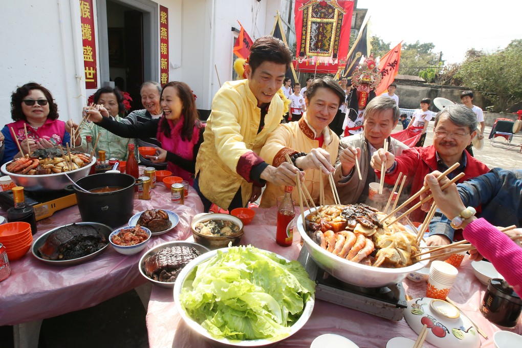 A poon choi feast is enjoyed by the whole community at Ng Ka Village, Kam Tin, Yuen Long, Hong Kong, at Lunar New Year, in 2017. Photo: SCMP