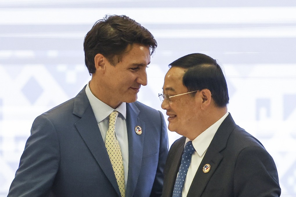 Canada’s Prime Minister Justin Trudeau greets Laos’ Prime Minister Sonexay Siphandone during the Asean-Canada Special Summit in Vientiane last Thursday. Photo: EPA-EFE