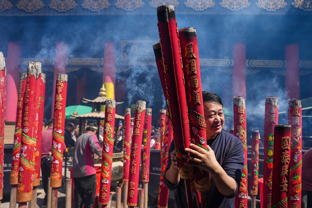 Worshippers burn incense sticks at Che Kung Temple, Sha Tin, one of the historic sites included in a guided tour offered this weekend in Hong Kong. It’s a way to stretch your legs. Photo: Eugene Lee