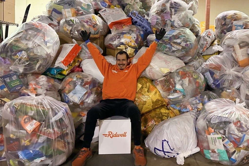 A Ridwell staff member poses with bags of items destined to be recycled. The company gathers hard-to-recycle items for a fee, picking up where city recyclers leave off. Photo: Facebook/Ridwell