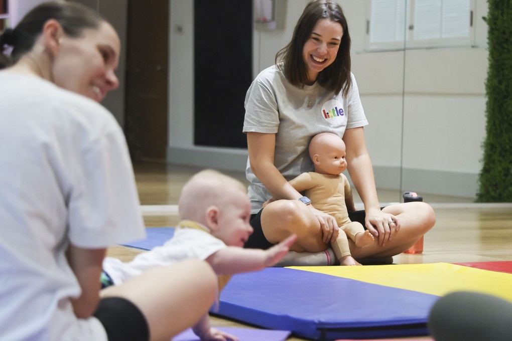 Baby massage eased postnatal depression for Jen Cooper (centre), who is now a teacher of baby movement classes in Hong Kong. Photo: Edmond So