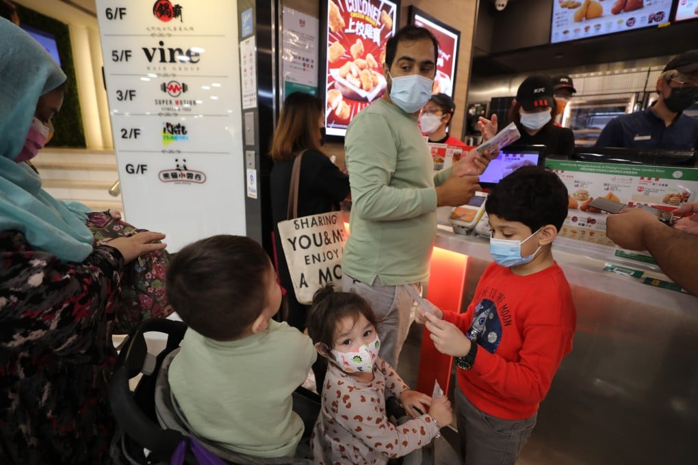 A Muslim family buys a meal at a halal-certified KFC store, on November 4, 2022, in Hong Kong. Photo: Xiaomei Chen