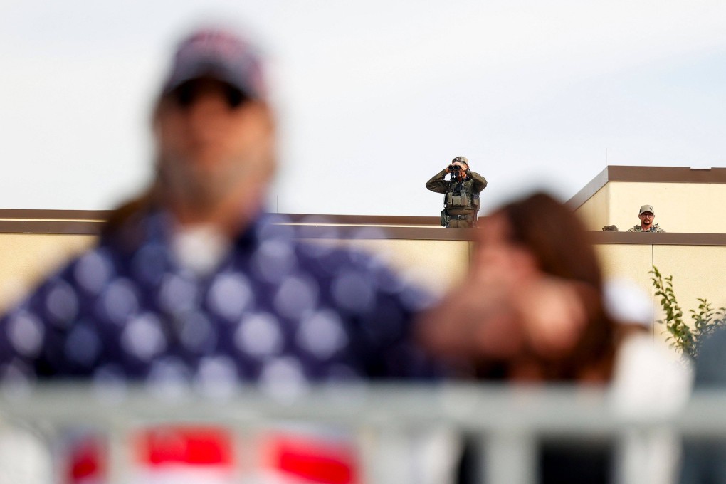 Members of Secret Service scan a crowd waiting to get in to see Republican presidential nominee Donald Trump speak at a rally in Aurora, Colorado. Photo: Getty Images via AFP