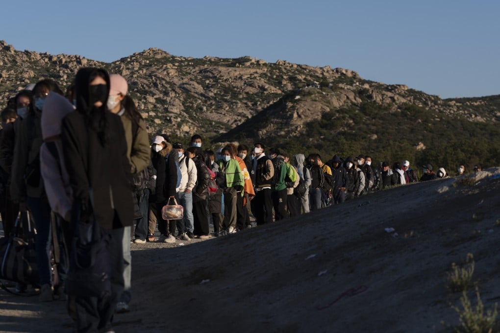 Chinese migrants wait to be processed after crossing the US-Mexican border on May 8, 2024, near Jacumba Hot Springs, California. Photo: AP