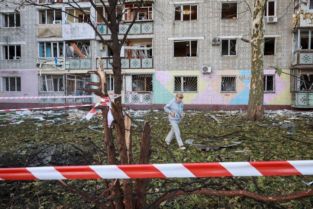 A resident of Chornomorsk, in the Odesa region of Ukraine, walks at the site of a Russian drone strike on October 9. Photo: Reuters