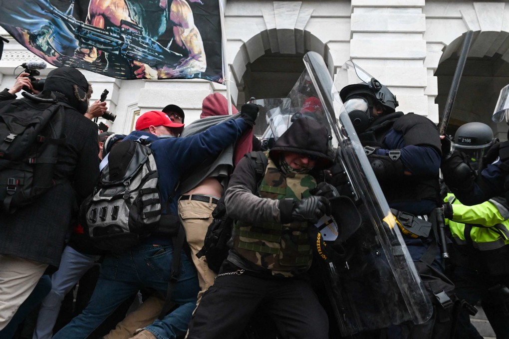 Riot police push back a crowd of supporters of US President Donald Trump after they stormed the US Capitol on January 6, 2021 in Washington, DC.  Photo: AFP