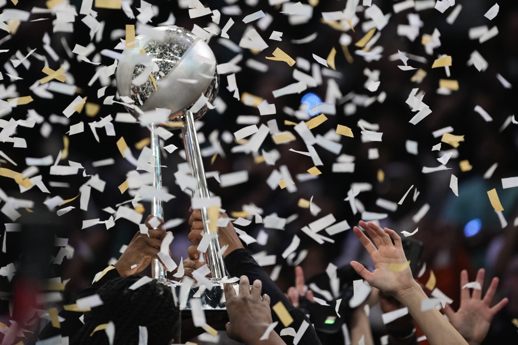 The New York Liberty hold up the championship trophy after beating the Minnesota Lynx in Game 5. Photo: AP