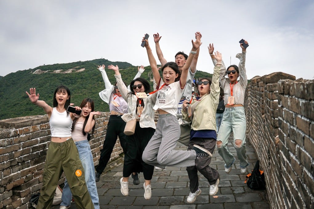 Participants in a cross-strait journalism camp pose for a photo at the Mutianyu section of the Great Wall in Beijing in August. Photo: Xinhua