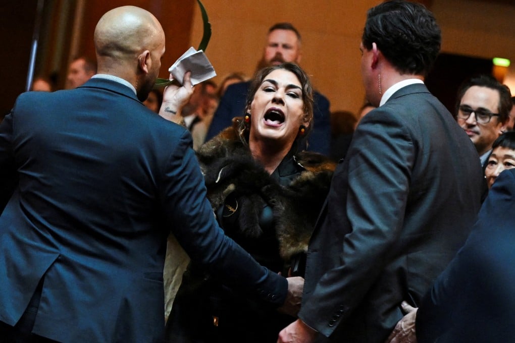 Australian Senator Lidia Thorpe is escorted out of Parliament House in Canberra on Monday as she stages a protest against Britain’s King Charles. Photo: Reuters