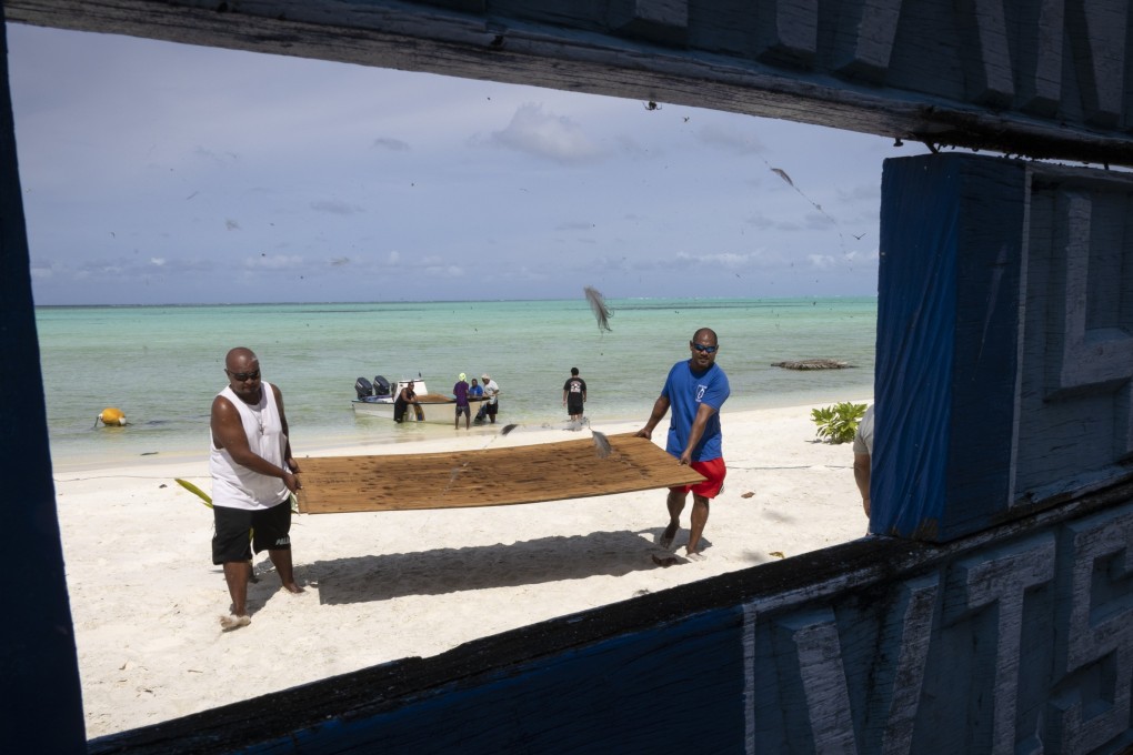 Wood is brought ashore on Helen Island, in Palau, for the team of rangers who protect the abundant sea life of Helen’s Reef from poachers. Photo: AP