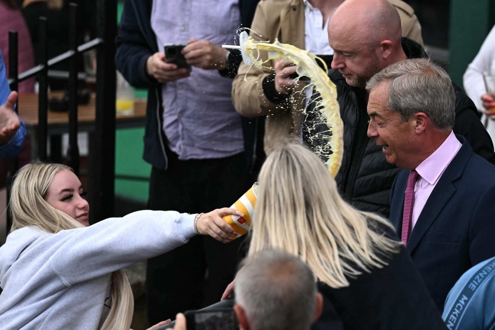 Victoria Thomas Bowen throws a milkshake in Nigel Farage’s face on June 4. Photo: AFP