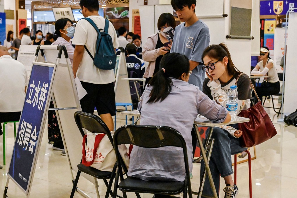 Young people attend a job fair in Beijing. China’s youth-unemployment rate improved slightly in September. Photo: Getty Images