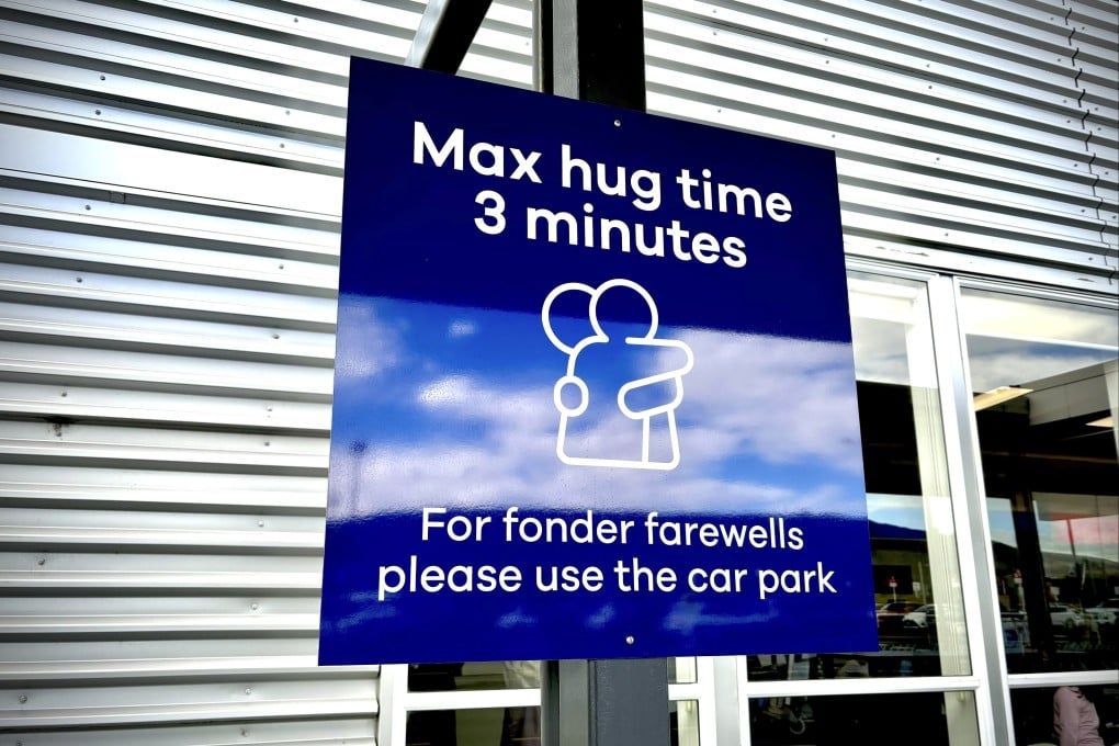 The max hug time sign in New Zealand’s Dunedin Airport went viral on social media, with some criticising it, and others finding it funny. Photo: AP