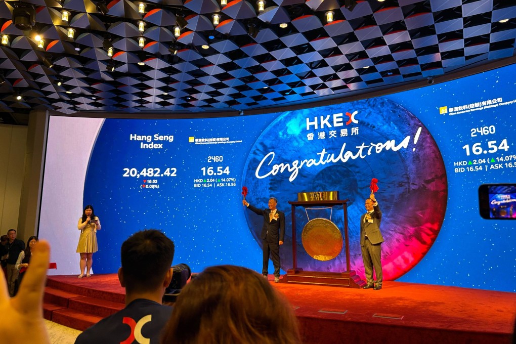 Executives of China Resources Beverage (Holdings) Company at the bottler’s trading debut in Hong Kong on October 23, 2024: Wang Xiangming, chairman of the parent company China Resources Group (left), and Zhang Weitong, chairman of the bottler (right). Photo: Mia Castagnone