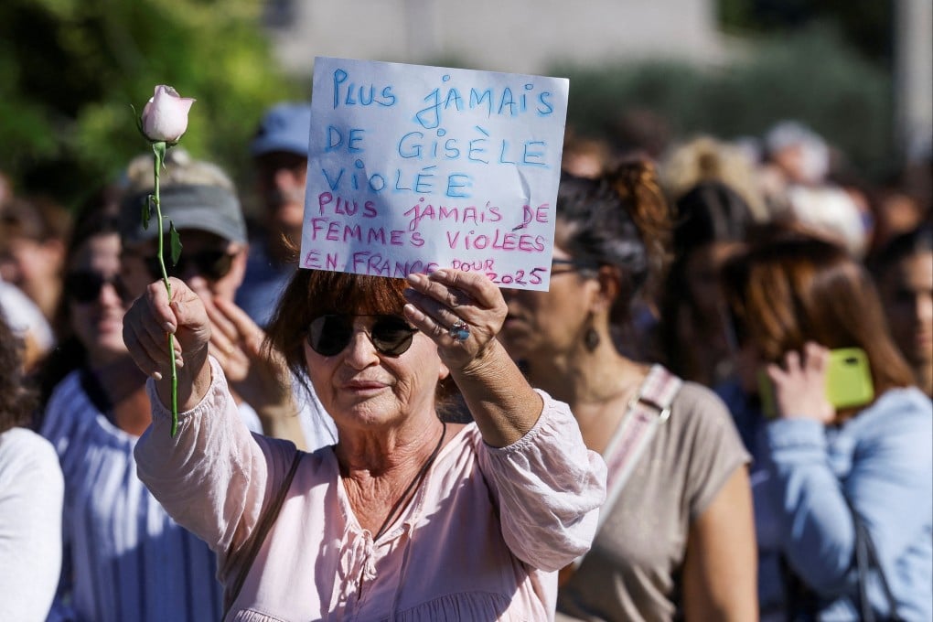 A woman holds a sign that reads “No more Gisele raped, no more women raped in France” and a white rose as a tribute to people who are victims of violence on the day of a silent march to support Gisele Pelicot, who has allegedly been drugged and raped by men solicited by her husband Dominique Pelicot at their home. Photo: Reuters