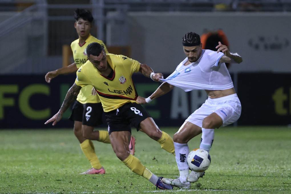 Lee Man’s Everton Camargo is fended off during the home loss to Nam Dinh. Photo: Jonathan Wong