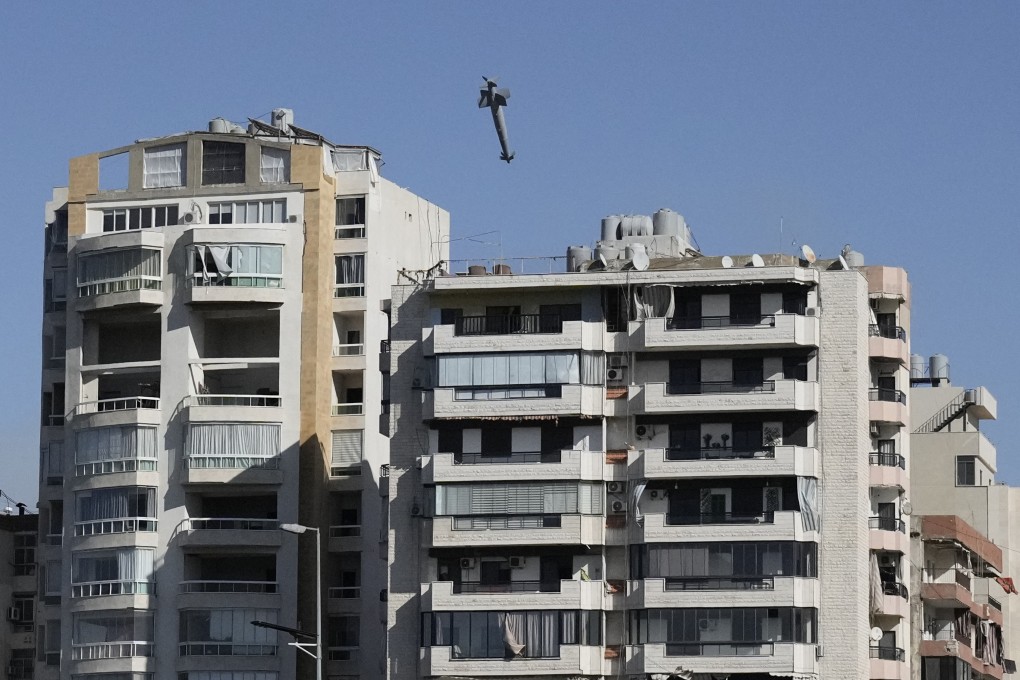A missile launched from an Israeli jet, a moment before it hits a building in Ghobeiri, Beirut. Photo: AP