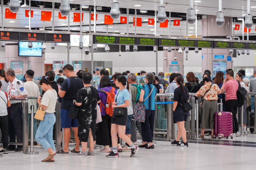 Travellers cross the border at Lok Ma Chau Control Point in September. Photo: Eugene Lee