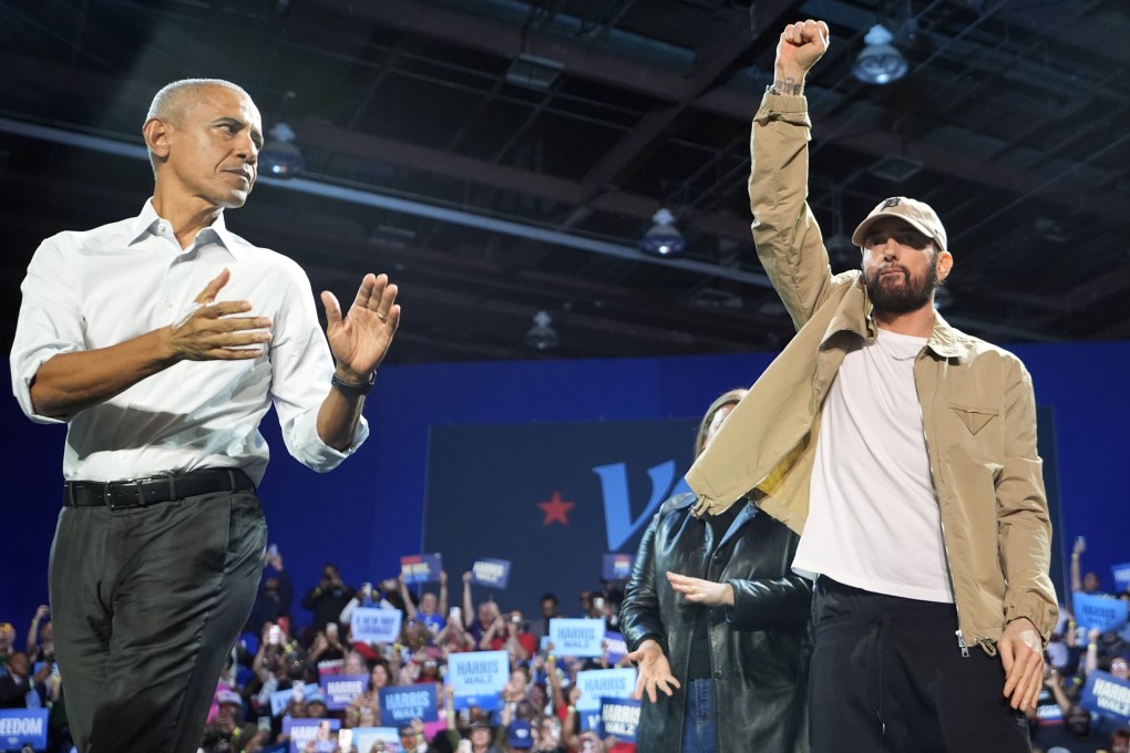 Rapper Eminem and former president Barack Obama at a campaign rally for Kamala Harris. Photo: AP