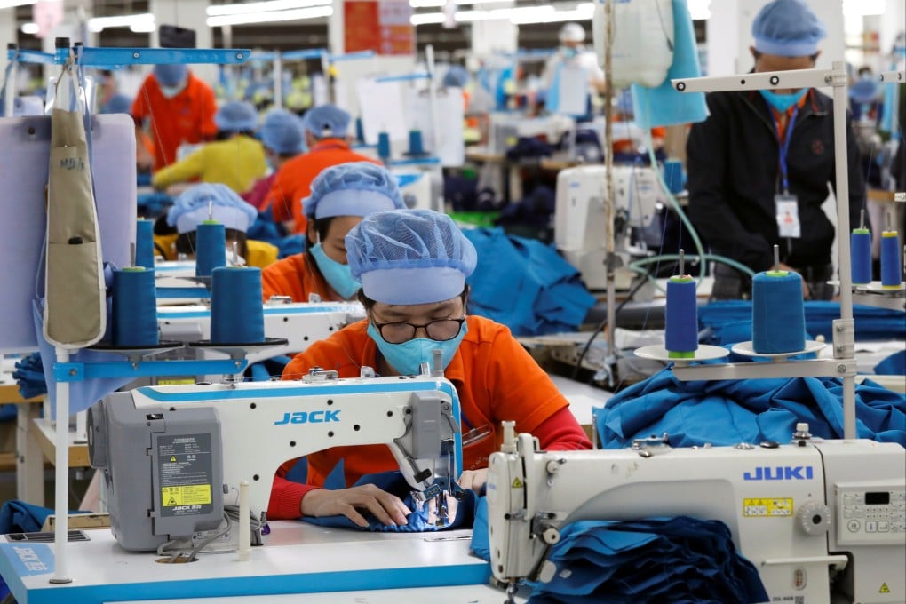 Employees work at a garment export factory in Hung Yen province, Vietnam, in December 2020. For many smaller firms, securing supply-chain finance from local banks is a significant challenge. Photo: Reuters