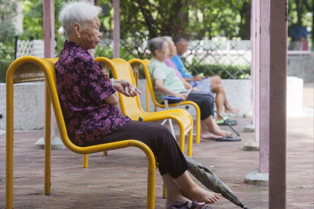 Elderly residents gather outside at a public housing estate in Tseung Kwan O in 2018. Photo: EPA-EFE