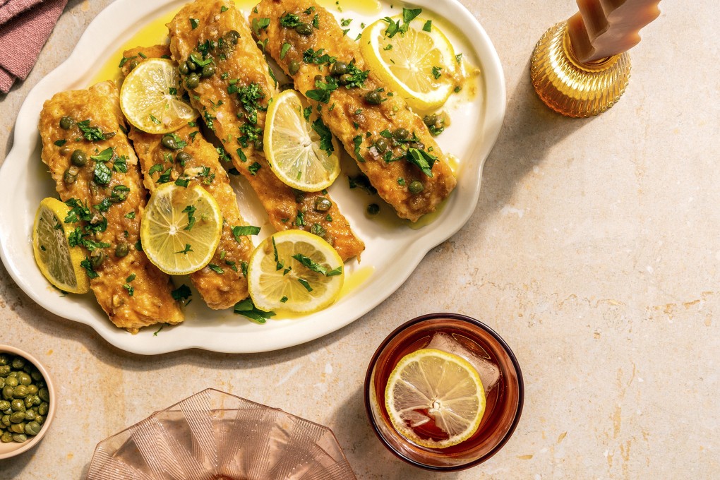 A recipe for salmon piccata in A Couple Cooks: 100 Recipes to Cook Together, in which married food bloggers Sonja and Alex Overhiser take the heat out of sharing the kitchen and promote “bonding moments”. Photo: Chronicle Books via AP