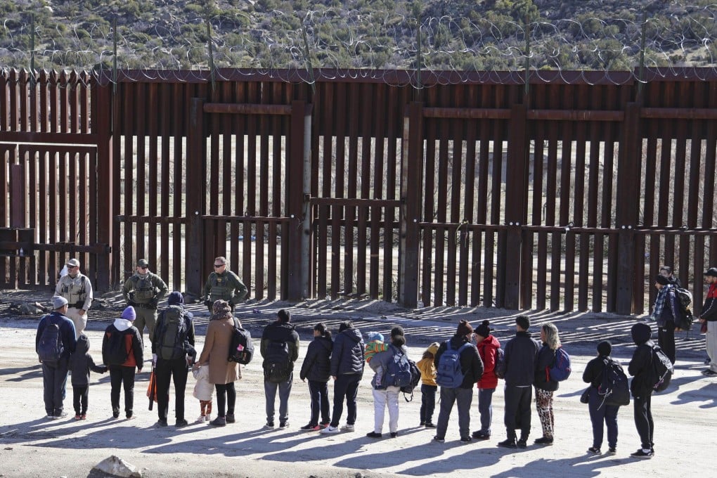 Chinese migrants in line in front of US Border Patrol agents at the US-Mexico border in Jacumba Hot Springs, California, on January 23, 2024. Photo: Kyodo